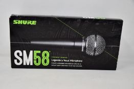 An as new Shure SM58 legendary vocal microphone.