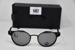 A pair of as new Oakley Deadbolt sunglasses Satin Black frame with Prizm Black Polarized lenses (