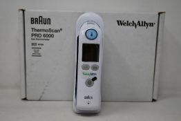A boxed as new Welch Allyn Braun ThermoScan PRO 6000 ear thermometer with cradle.