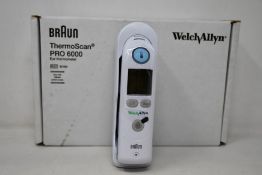 A boxed as new Welch Allyn Braun ThermoScan PRO 6000 ear thermometer with cradle.