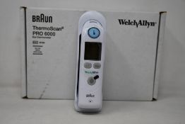 A boxed as new Welch Allyn Braun ThermoScan PRO 6000 ear thermometer with cradle.