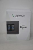 A boxed as new Lightwave Smart Dimmer (4 Gang) - L24 Stainless Steel.