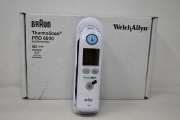 A boxed as new Welch Allyn Braun ThermoScan PRO 6000 ear thermometer with cradle.