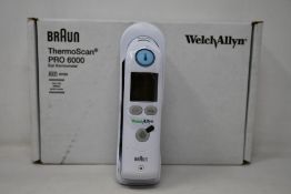 A boxed as new Welch Allyn Braun ThermoScan PRO 6000 ear thermometer with cradle.