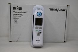 A boxed as new Welch Allyn Braun ThermoScan PRO 6000 ear thermometer with cradle.