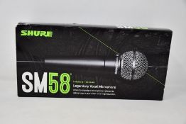 An as new Shure SM58 legendary vocal microphone.