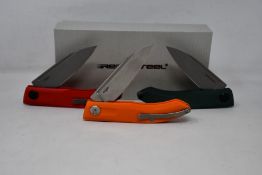 Six as new Real Steel Stella pocket knives (4x Red/Greywash, 1x Green/Greywash and 1x Orange G10).