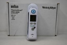 A boxed as new Welch Allyn Braun ThermoScan PRO 6000 ear thermometer with cradle.
