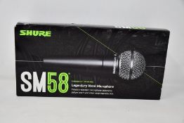 An as new Shure SM58 legendary vocal microphone.