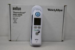 A boxed as new Welch Allyn Braun ThermoScan PRO 6000 ear thermometer with cradle.