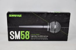 An as new Shure SM58 legendary vocal microphone.