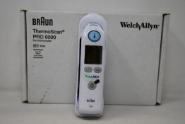 A boxed as new Welch Allyn Braun ThremoScan PRO 6000 ear thermometer with cradle (Box has some minor
