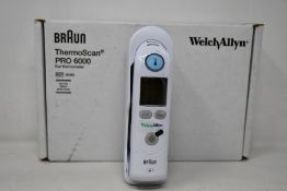 A boxed as new Welch Allyn Braun ThermoScan PRO 6000 ear thermometer with cradle.
