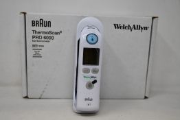 A boxed as new Welch Allyn Braun ThermoScan PRO 6000 ear thermometer with cradle.