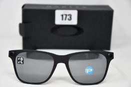 A pair of as new Oakley Apparition sunglasses Satin Black frame with Black iridium Polarized