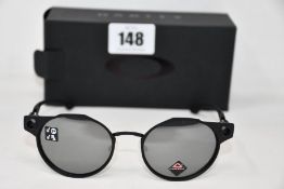 A pair of as new Oakley Deadbolt sunglasses Satin Black frame with Prizm Black Polarized lenses (
