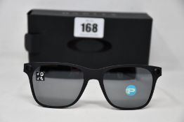 A pair of as new Oakley Apparition sunglasses Satin Black frame with Black iridium Polarized