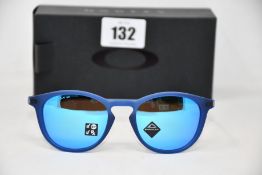 A pair of as new Oakley Pitchman R glasses matte translucent blue frame with Prizm Sapphire