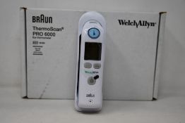 A boxed as new Welch Allyn Braun ThermoScan PRO 6000 ear thermometer with cradle.