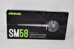 An as new Shure SM58 legendary vocal microphone.