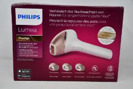 A boxed as new Philips Lumea Prestige hair removal device.