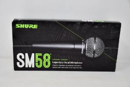 An as new Shure SM58 legendary vocal microphone.