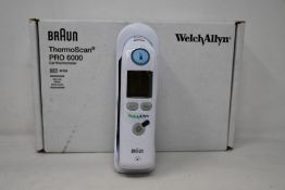 A boxed as new Welch Allyn Braun ThermoScan PRO 6000 ear thermometer with cradle.