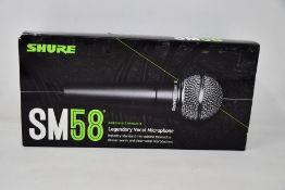 An as new Shure SM58 legendary vocal microphone.