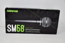 An as new Shure SM58 legendary vocal microphone.