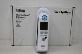 A boxed as new Welch Allyn Braun ThermoScan PRO 6000 ear thermometer with cradle.