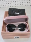 A pair of as new Mui Mui sunglasses.