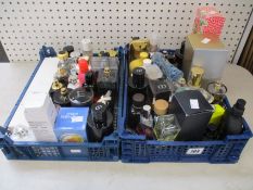 Two crates of part used eau de parfum/toilette to include YSL, Christian Dior, Paco Robanne, Hugo