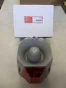 A Cooper Wheelock ASRS-R-DC Multi-Alarm 24VDC Outdoor 104075, grey/red strobe.