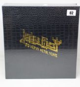 An as new Judas Priest 50 Heavy Metal Years sealed collectible with crocodile binding and gold