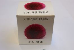 Forty 100% vegan faux fur pom poms.