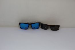 Two pairs of as new Oakley sunglasses; Holbrook XL and Silver Stealth.