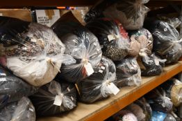 Fourteen bags of assorted pre-owned clothing and related items.