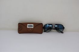 A pair of as new Ray Ban sunglasses.
