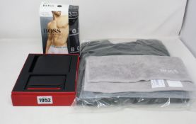 As new Hugo Boss items; a wallet and card holder set, three pack of boxer trunks (XL), flannel,