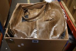 Six as new Renata Corsi Lola shopper bags in brown and two in red (€49 each).