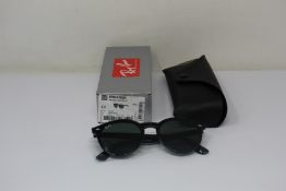 A pair of as new Ray Ban sunglasses.