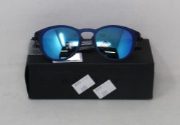 A boxed as new pair of Oakley Pitchman R glasses matte translucent blue frame with Prizm Sapphire