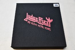 A Judas Priest 50 Heavy Metal Years collectors book (Book is not sealed).