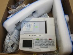 A pre-owned Mortara Instrument ELI 150c Interpretive ECG EKG Machine with patient cables, electrodes