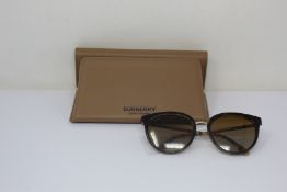 A pair of as new Burberry sunglasses.