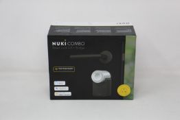 A boxed as new Nuki Combo Smart lock 2.0 + Bridge (Compatible with UK sockets).