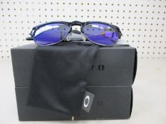 Two boxes of as new Oakley Latch Key sunglasses polished black frame with violet iridium (