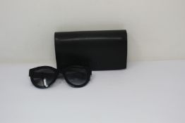 A pair of as new Chanel sunglasses.