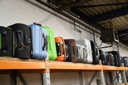 A quantity of empty suitcases/holdalls (Approximately 30 items).