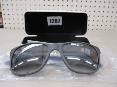 A pair of as new Calvin Klein sunglasses.